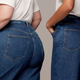 2 models offer a rear view of Unspun jeans in different sizes